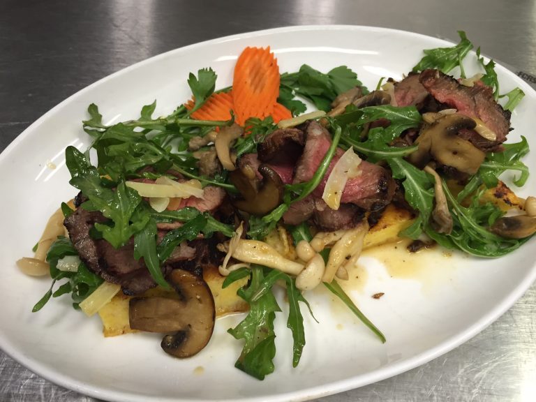 PorciniRubbed Steak with Crispy Polenta, Mixed Mushrooms and Arugula